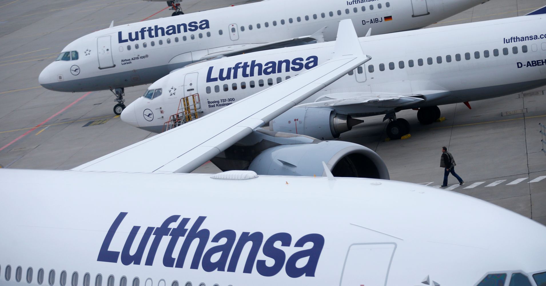 Lufthansa airplanes are parked on the tarmac at Frankfurt airport, Germany.