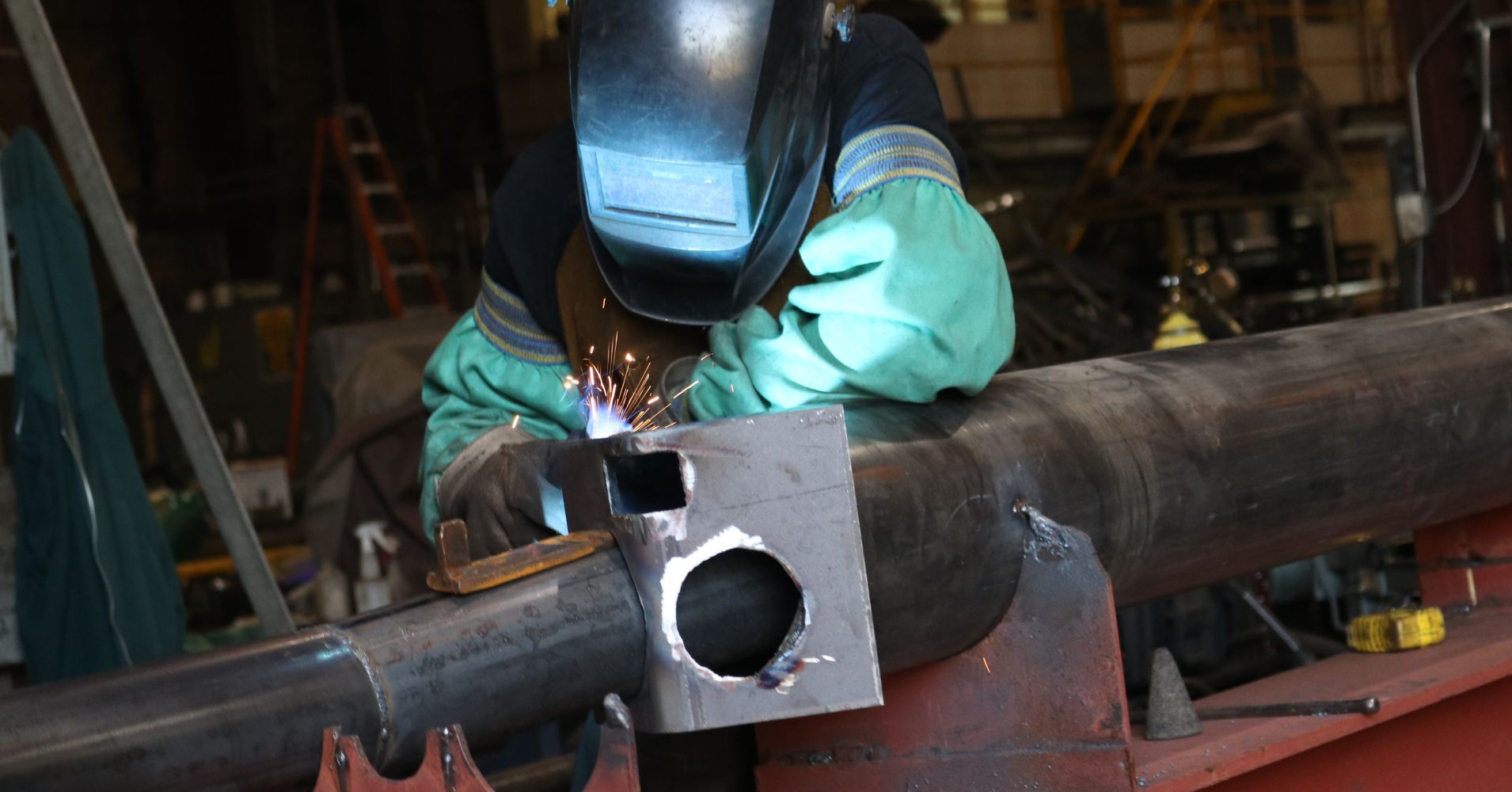 ORANGE COUNTY - AUGUST 7: A welder working on a steel piece at a metal fabrication company on August 7, 2018 in Orange County, New York.