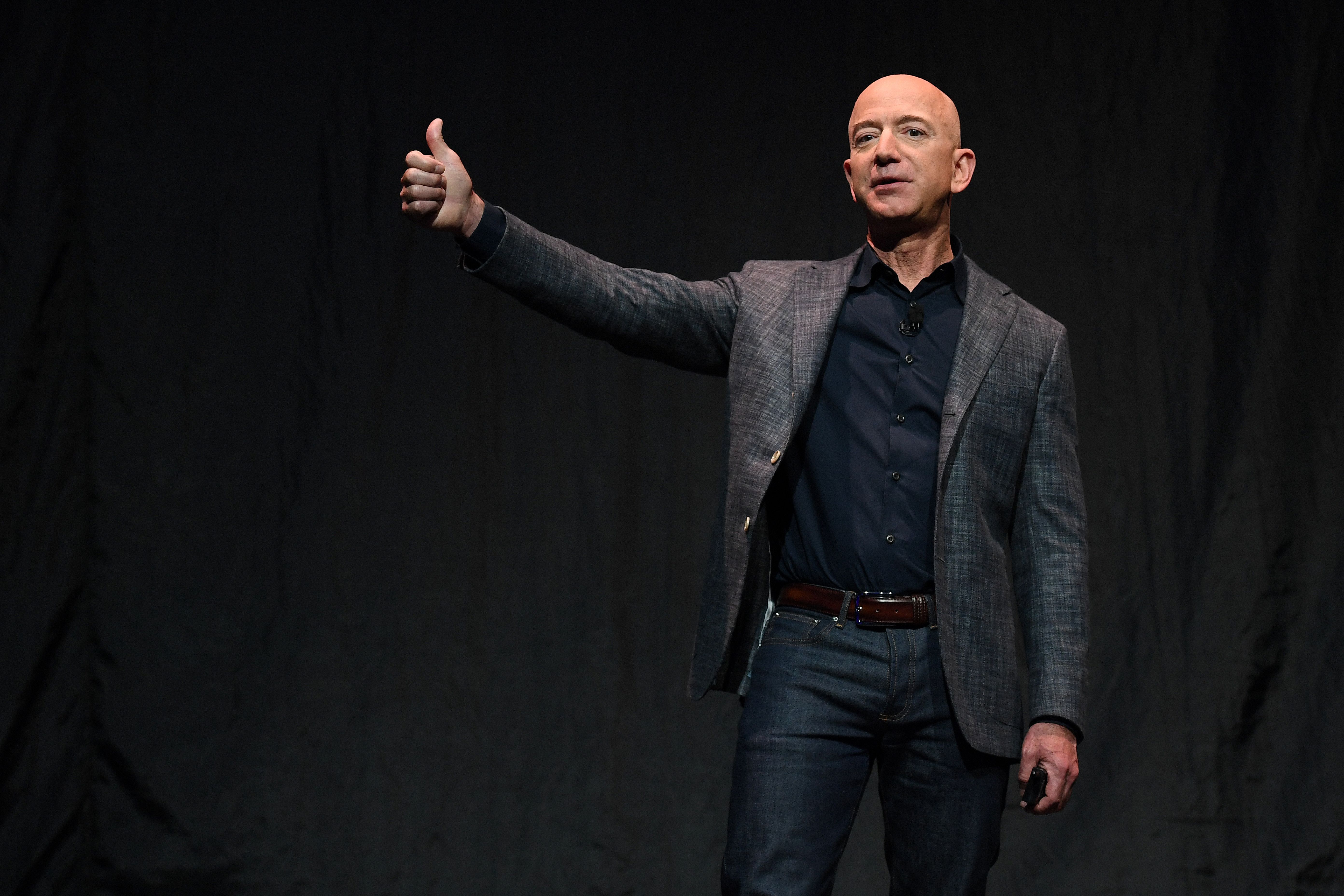 Jeff Bezos lifts dirt pile to kick off Amazon $1.4 billion air hub