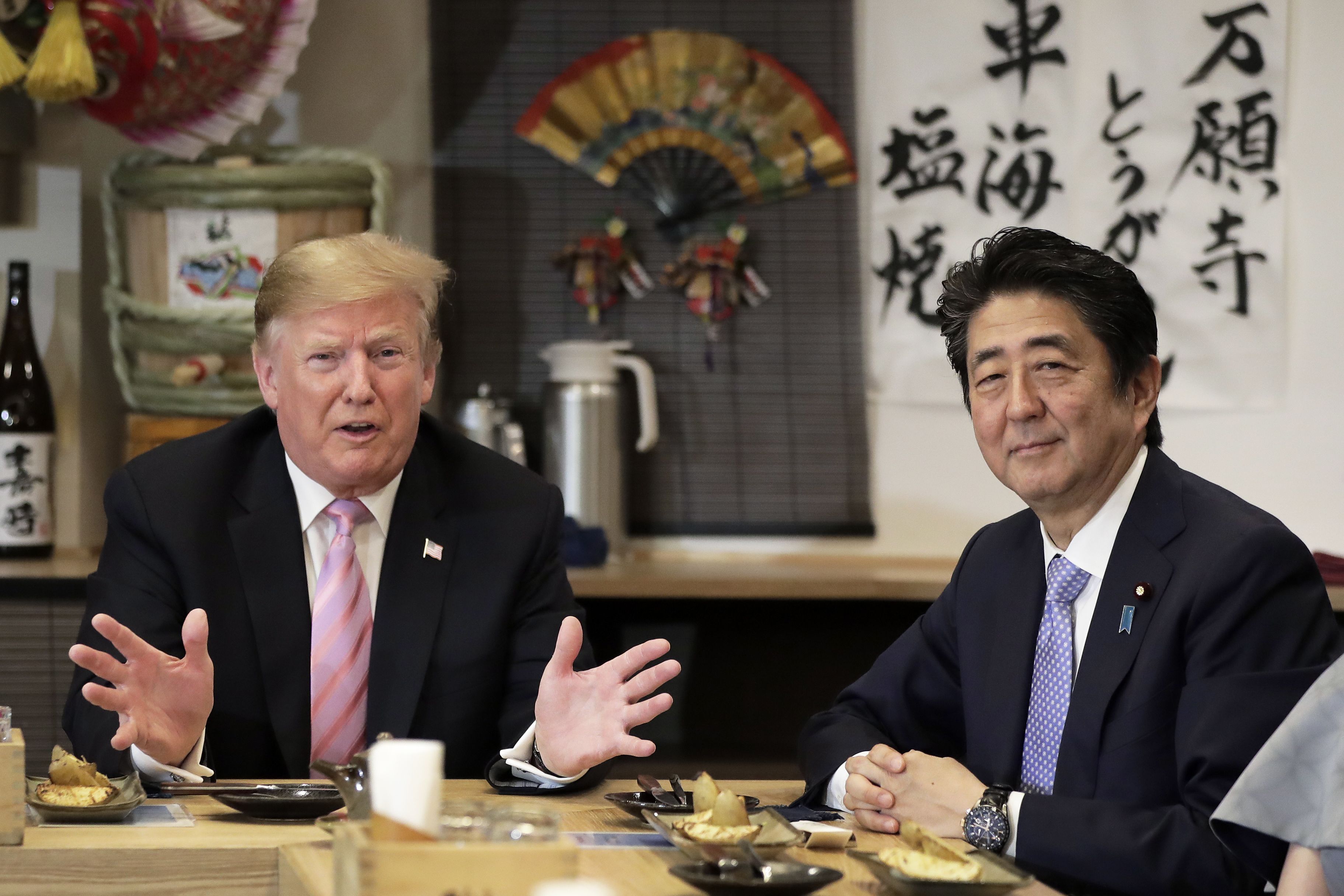 Trump concludes Japan visit as trade official plays down August deal