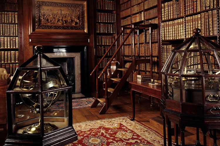 What was the real purpose of the English country house library?