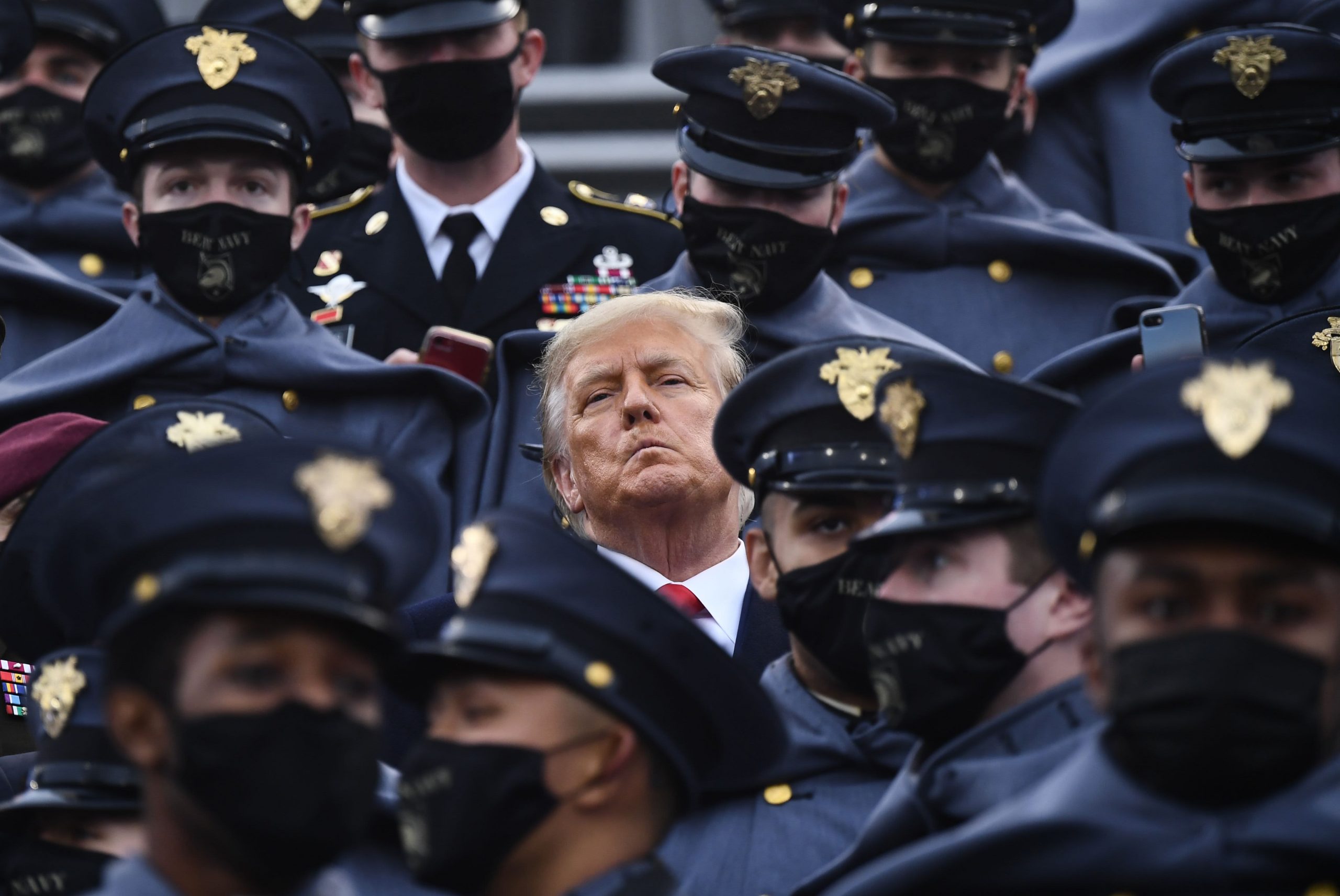 Trump doesn't — then briefly does — wear mask in stands at Army-Navy football game as Covid rages across U.S.