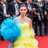 Elvira Gavrilova wears a blue and yellow dress at the Cannes Film Festival: a luxurious look